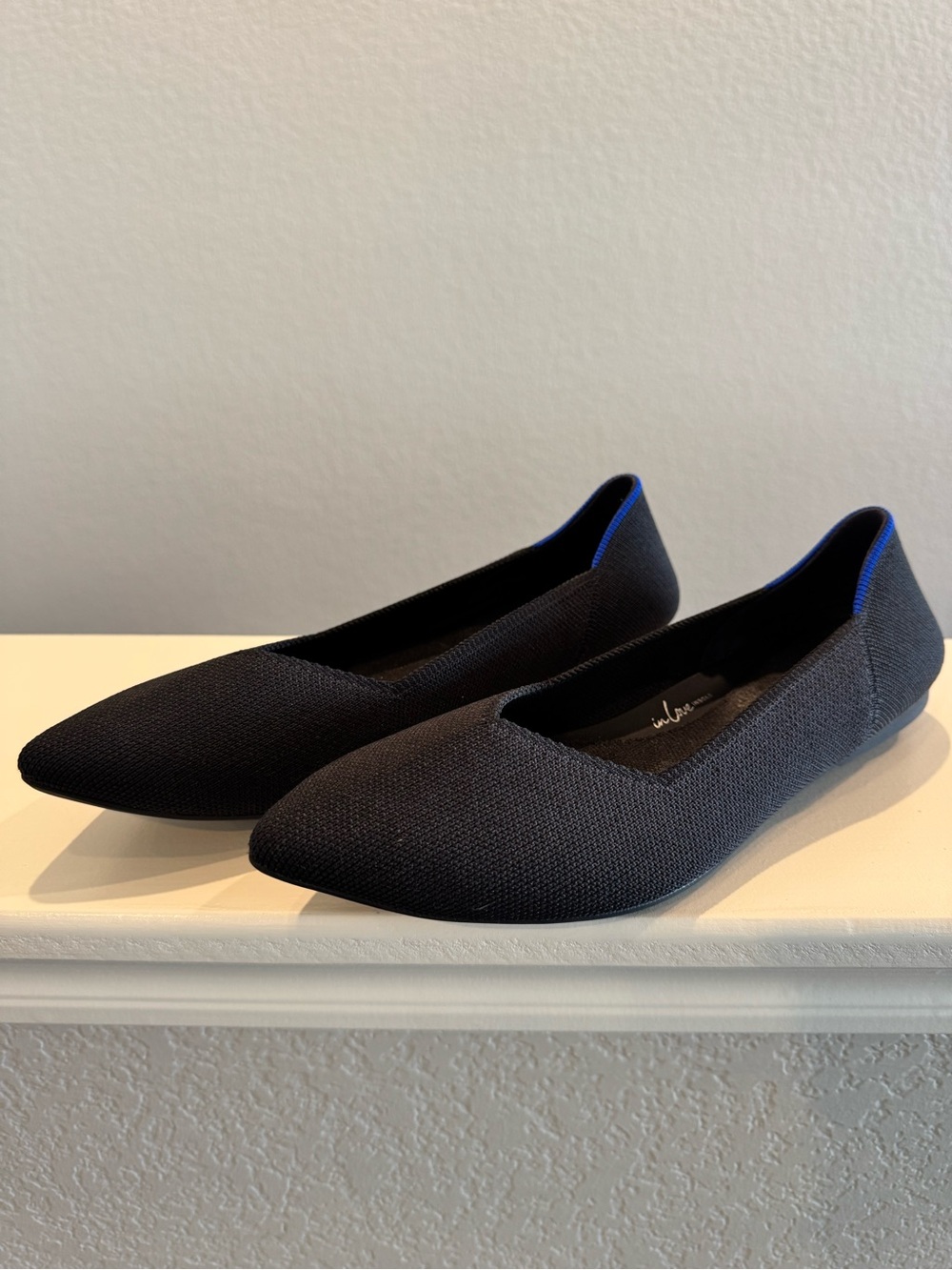 Rothy's Black Pointed Toe Flats with Blue Trim